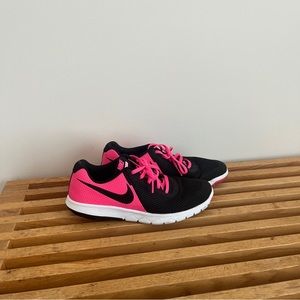 pink and black nike running sneakers